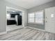 Dining area with kitchen view and wood-look floors at 143 N Woodward Ave, Deland, FL 32720