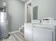 Convenient laundry room with washer, dryer, and water heater at 143 N Woodward Ave, Deland, FL 32720