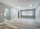 Open living space with wood-look floors and built-ins at 143 N Woodward Ave, Deland, FL 32720
