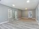 Spacious living room with wood-look floors at 143 N Woodward Ave, Deland, FL 32720