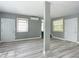 Open living area with dual entry doors and wood-look floors at 143 N Woodward Ave, Deland, FL 32720