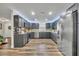 Modern kitchen with gray cabinets, mosaic backsplash, and stainless steel appliances at 2505 Hillside Ave, Orange City, FL 32763