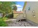 Backyard with wooden deck, white fence, and lush greenery at 402 Oakwood Ave, New Smyrna Beach, FL 32169