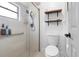 Clean bathroom with shower stall, toilet, and floating shelves at 47 Community Dr, Debary, FL 32713