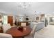 Open dining room with round wooden table and chandelier at 47 Community Dr, Debary, FL 32713