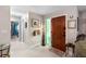 Bright and spacious entryway with tile floors and wooden door at 47 Community Dr, Debary, FL 32713