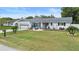 Ranch style home with well maintained lawn at 47 Community Dr, Debary, FL 32713