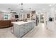 Modern kitchen with gray island and stainless steel appliances at 47 Community Dr, Debary, FL 32713