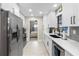 Modern kitchen with white cabinets and stainless steel appliances at 47 Community Dr, Debary, FL 32713