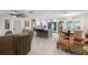 Open concept kitchen with island and dining area at 47 Community Dr, Debary, FL 32713