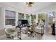 Sunlit home office with a desk, chair, and plenty of natural light at 47 Community Dr, Debary, FL 32713