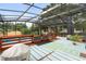 Relaxing pool area with covered patio and deck at 47 Community Dr, Debary, FL 32713
