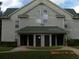 Condo building exterior, featuring three units and a walkway at 6106 Westgate Dr # 102, Orlando, FL 32835