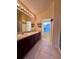 Double vanity bathroom with a separate toilet area and shower at 6430 S Goldenrod Rd # 15B, Orlando, FL 32822