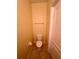Small half bathroom with toilet and sink at 6430 S Goldenrod Rd # 15B, Orlando, FL 32822