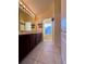 Bathroom with double vanity, light wood cabinets and tiled floor at 6430 S Goldenrod Rd # 15B, Orlando, FL 32822