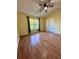 Spacious bedroom with wood flooring and ceiling fan at 6430 S Goldenrod Rd # 15B, Orlando, FL 32822