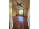 Spacious bedroom with wood flooring and ceiling fan at 6430 S Goldenrod Rd # 15B, Orlando, FL 32822