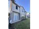 Townhome side view with landscaping and patio at 6430 S Goldenrod Rd # 15B, Orlando, FL 32822