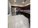 Modern kitchen with stainless steel appliances and dark wood cabinets at 6430 S Goldenrod Rd # 15B, Orlando, FL 32822