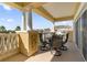 Spacious balcony with table and chairs, offering scenic views at 7600 Sandy Ridge Dr # 402, Reunion, FL 34747