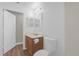 Clean bathroom with single vanity and tub shower combo at 1111 Sea Eagle Ave, Groveland, FL 34736