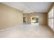 Large main bedroom with ceiling fan, carpet, and sliding glass doors at 2169 Smoaks St, The Villages, FL 32162