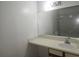 Clean bathroom with a vanity, mirror, and tub shower combo at 2260 Cascades Blvd # 107, Kissimmee, FL 34741