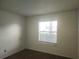 Bedroom with window and wood flooring at 2260 Cascades Blvd # 107, Kissimmee, FL 34741