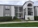 Two-story building exterior with stairs and balcony at 2260 Cascades Blvd # 107, Kissimmee, FL 34741