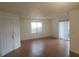 Bright living room featuring wood floors and sliding glass doors at 2260 Cascades Blvd # 107, Kissimmee, FL 34741