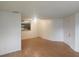 Open living area with wood floors and kitchen at 2260 Cascades Blvd # 107, Kissimmee, FL 34741
