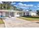 Newly renovated home with a large driveway and landscaped yard at 3513 Ibis Dr, Orlando, FL 32803