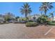 Brick paved community entrance with lush landscaping and palm trees at 4352 S Kirkman Rd # 1213, Orlando, FL 32811