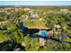 Aerial view showing community pool and surrounding buildings at 6021 Windhover Dr # F11, Orlando, FL 32819