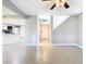 Open living space with kitchen view and tile floors at 6021 Windhover Dr # F11, Orlando, FL 32819