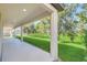 Covered patio with view of grassy backyard at 8441 Chilton Dr, Orlando, FL 32836