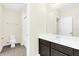Clean bathroom with dark vanity, toilet, and shower/tub combo at 8441 Chilton Dr, Orlando, FL 32836