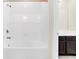 Bright bathroom with white tiled walls and a large bathtub at 8441 Chilton Dr, Orlando, FL 32836