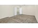 Bedroom with neutral carpeting and access to bonus room at 8441 Chilton Dr, Orlando, FL 32836