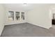 Well-lit bedroom with neutral carpeting and windows at 8441 Chilton Dr, Orlando, FL 32836