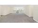 Spacious bonus room with carpeting and open railing at 8441 Chilton Dr, Orlando, FL 32836