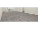 Large bonus room with carpeting and view of second floor at 8441 Chilton Dr, Orlando, FL 32836
