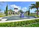 Community clubhouse with fountain and landscaping at 8441 Chilton Dr, Orlando, FL 32836