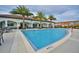 Resort-style pool with ample seating and umbrellas at 8441 Chilton Dr, Orlando, FL 32836