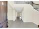 Bright and spacious entryway with a grand staircase at 8441 Chilton Dr, Orlando, FL 32836