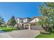 Two-story house with a paver driveway and lush landscaping at 8441 Chilton Dr, Orlando, FL 32836