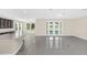 Open Gathering room with sliding glass doors leading to the backyard at 8441 Chilton Dr, Orlando, FL 32836