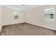 Spacious bedroom with neutral carpeting and window at 8441 Chilton Dr, Orlando, FL 32836