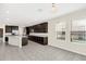Kitchen with dark cabinets, stainless steel appliances and an island at 8441 Chilton Dr, Orlando, FL 32836